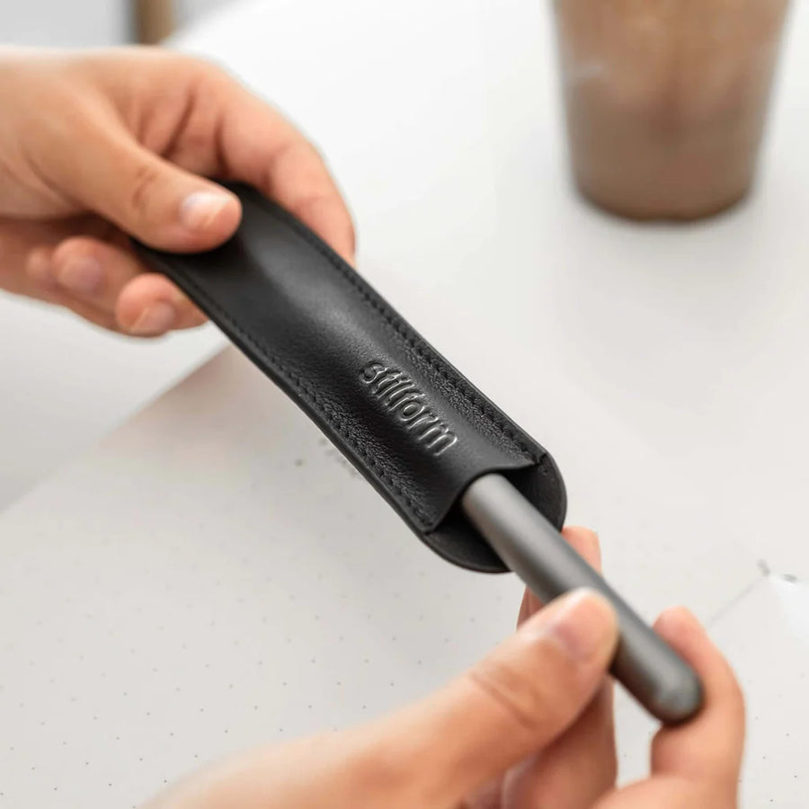 Stilform Leather Pouch in Black, showcasing a sleek and minimalist design holding a Stilform pen